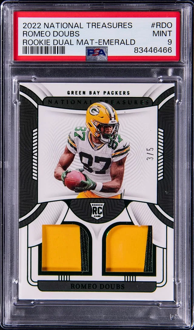 2022 Panini National Treasures Romeo Doubs Dual Materials Emerald #RDM-RDO card image
