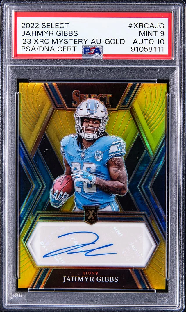 2022 Panini Select Jahmyr Gibbs 2023 XRC Mystery Autograph Gold #XRCA-JG card image