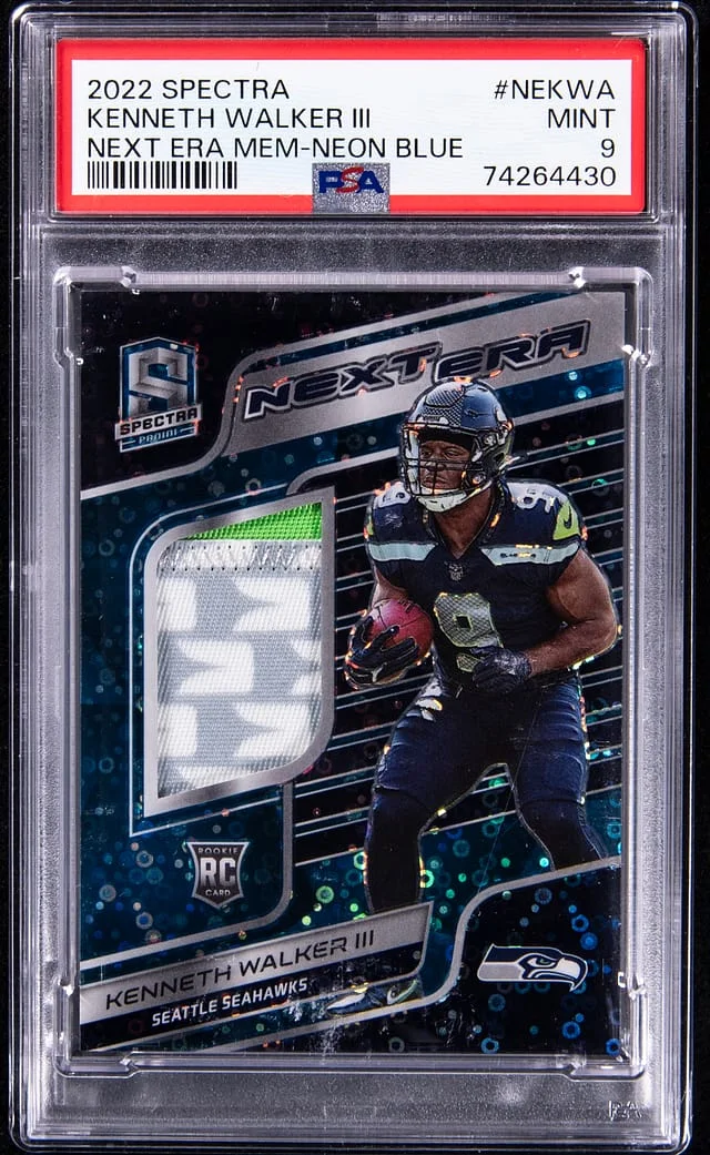 2022 Panini Spectra Kenneth Walker III Next ERA Memorabilia Neon Blue #NE-KWA card image