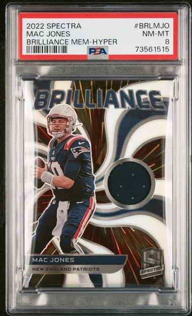 2022 Panini Spectra Mac Jones Brilliance Memorabilia Hyper #BRL-MJO card image