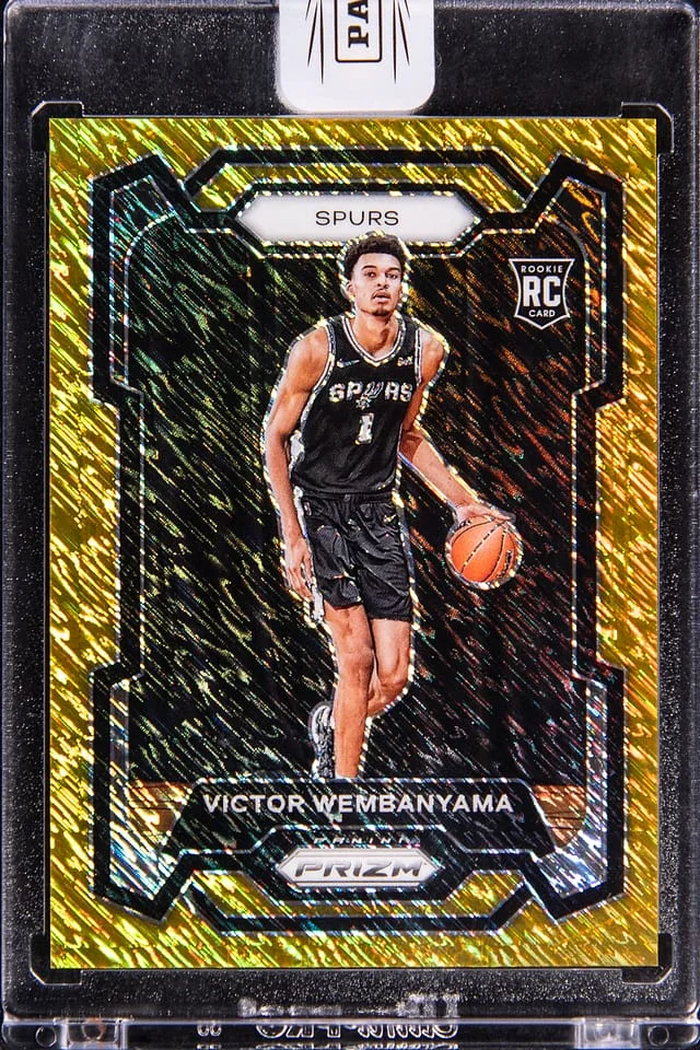 2023-24 Panini Prizm Victor Wembanyama - Panini Encased Gold Shimmer Prizm 1st Off the Line (FOTL) #136 card image