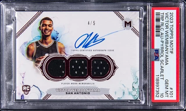 2023-24 Topps Victor Wemnamyama Motif Triple Relic Autograph Pyrrol Scarlet #101 card image