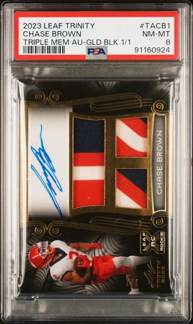 2023 Leaf Trinity Chase Brown Triple Memorabilia Autographs Gold Black 1/1 #TACB1 card image