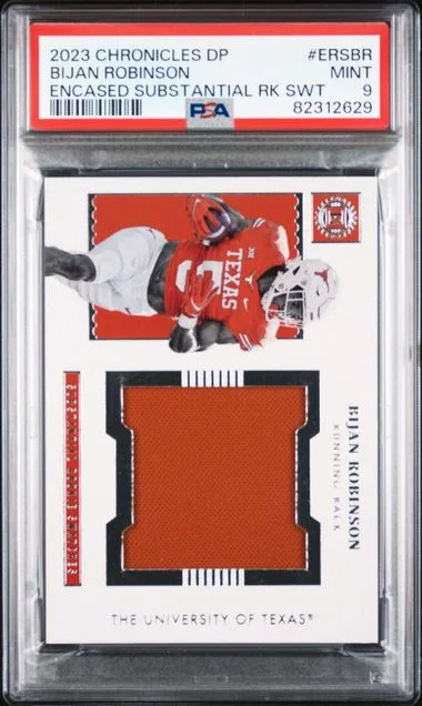 2023 Panini Chronicles Draft Picks Encased Substantial Swatches Ersbr Bijan Robinson #no-number card image