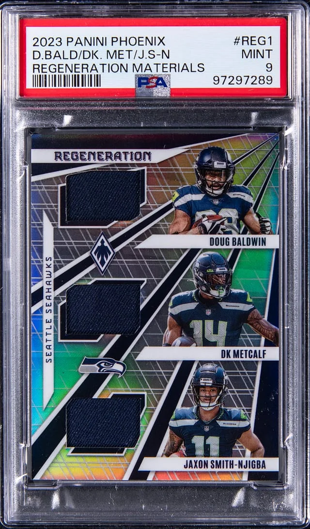 2023 Panini Doug Baldwin/DK Metcalf/Jaxon Smith-Njigba Phoenix Regeneration Materials #REG-1 card image