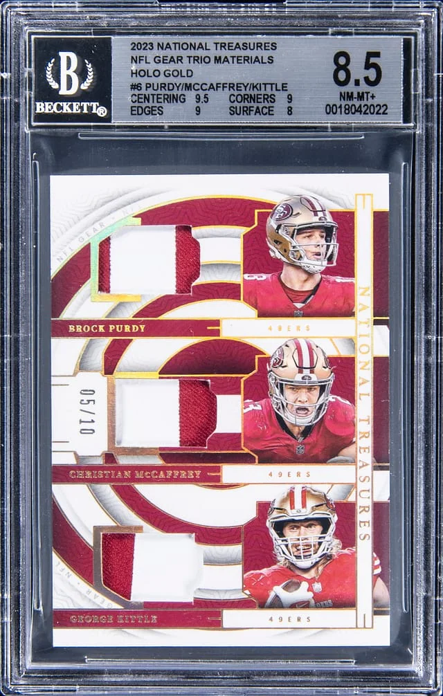 2023 Panini National Treasures Brock Purdy/Christian McCaffrey/George Kittle NFL Gear Trio Materials-Holo Gold #6 card image