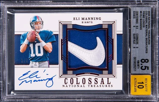 2023 Panini National Treasures Eli Manning Colossal Material Signatures Prime Logos #COL-EMA card image