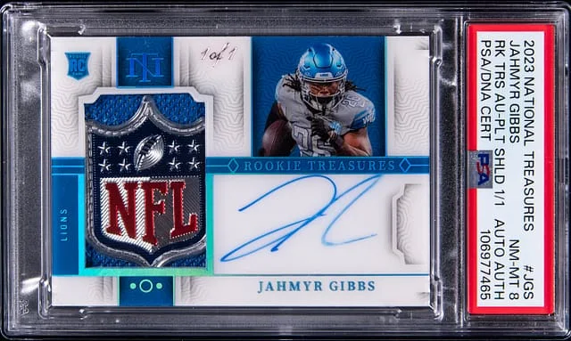 2023 Panini National Treasures Jahmyr Gibbs Treasures Autograph Platinum Shield #RTS-JGS card image