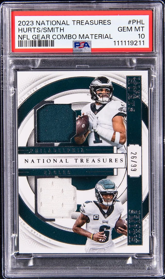 2023 Panini National Treasures Jalen Hurts/Devonta Smith Dual-Relic NFL Gear Combo Material #GCM-PHL card image