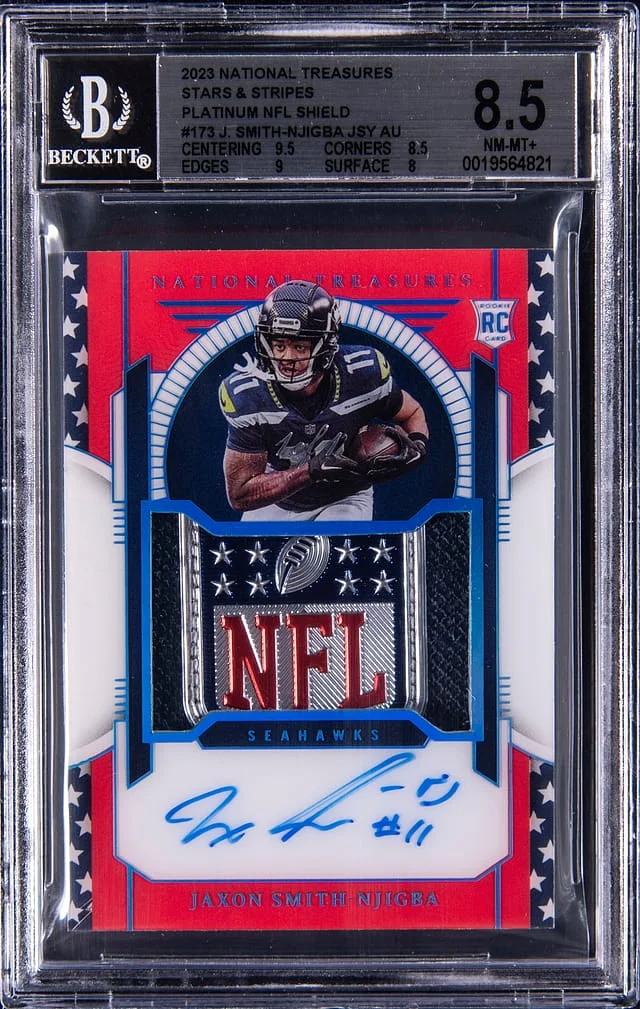 2023 Panini National Treasures Jaxon Smith-Njigba Patch Autograph (RPA) Stars & Stripes Platinum NFL Shield #173 card image