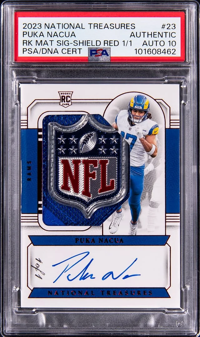 2023 Panini National Treasures Puka Nacua Material Signatures Shield Red #23 card image