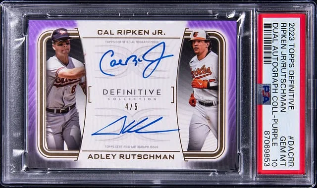 2023 Topps Cal Ripken Jr./Adley Rutschman Definitive Dual Autograph Collection Purple #DACRR card image