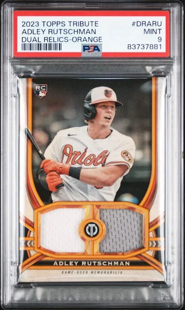 2023 Topps Tribute Adley Rutschman Tribute Dual Relics Single Player Orange #DR-ARU card image