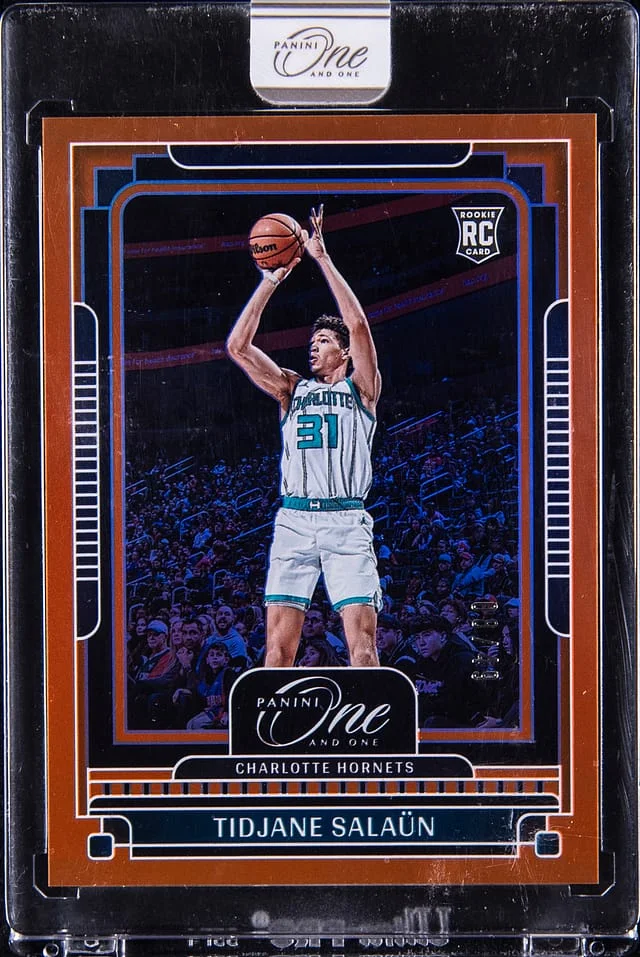2024-25 Panini One and One Tidjane Salaun - Panini Encased Orange #123 card image