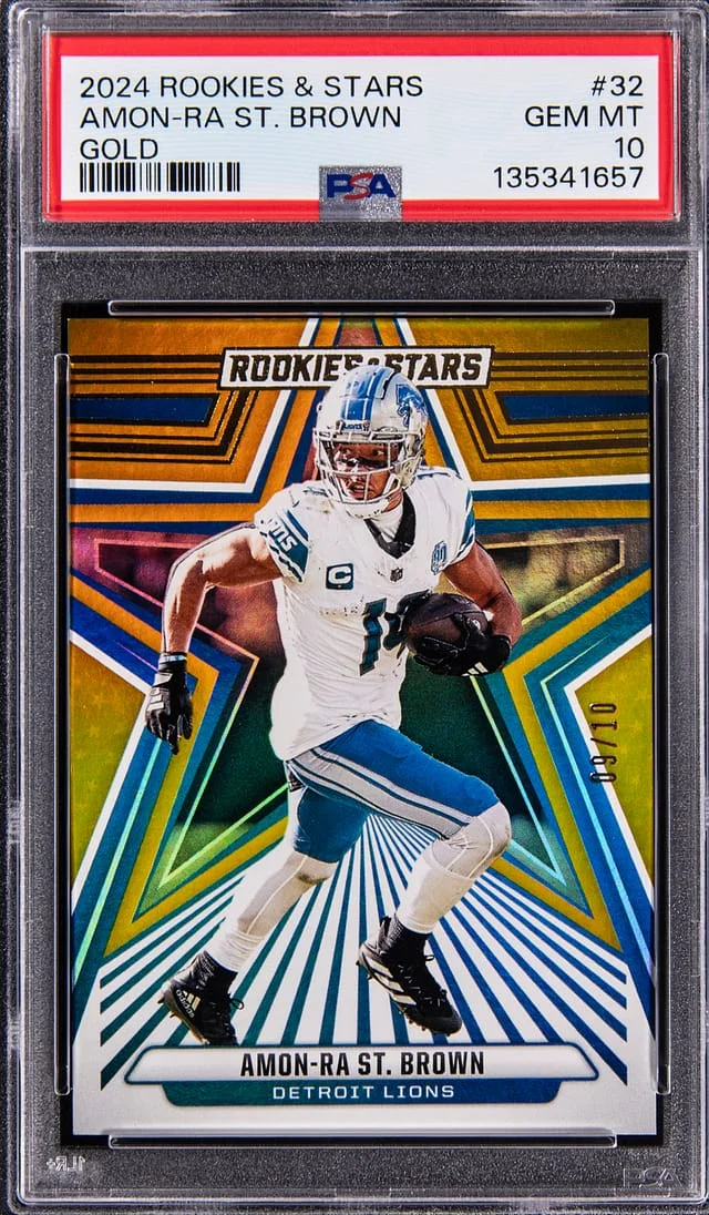 2024 Panini Amon-Ra St. Brown Rookies & Stars Gold #32 card image