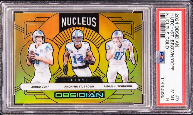 2024 Panini Obsidian Jared Goff/Amon-Ra St. Brown/Aidan Hutchinson Nucleus Gold #9 card image