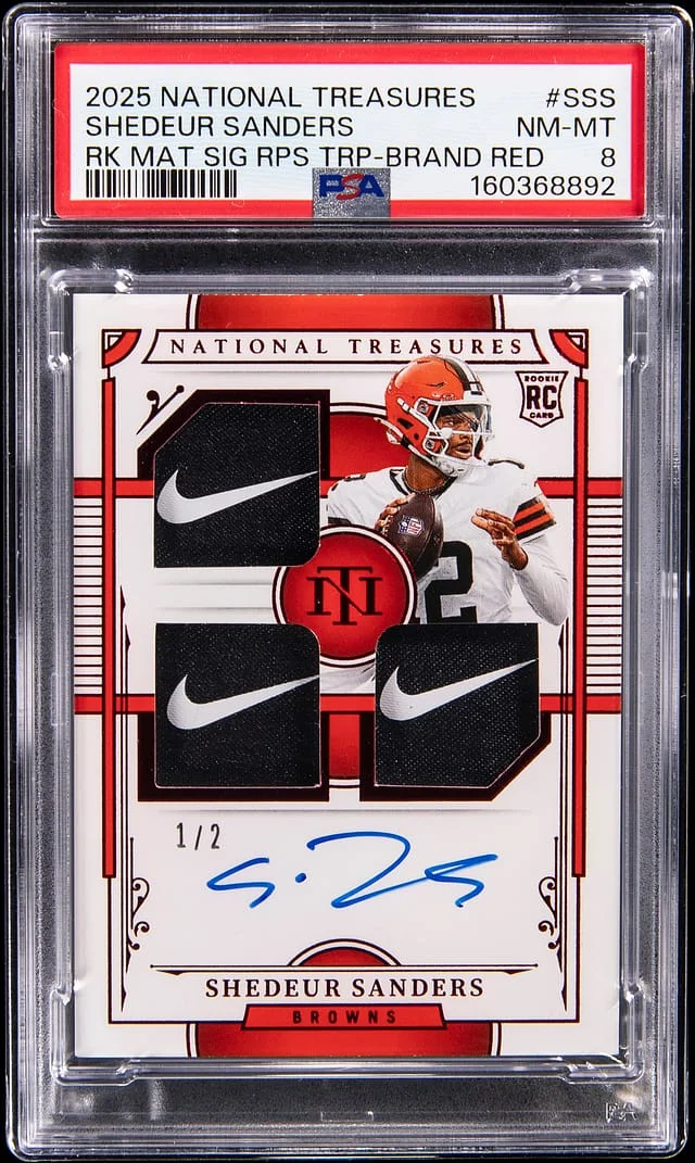 2025 Panini National Treasures Shedeur Sanders Material Signatures RPS Triple Brand Logo Red #RMS-SSS card image
