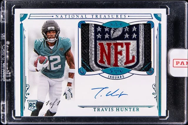 2025 Panini National Treasures Travis Hunter Patch Autographs (RPA) Platinum NFL Shield #156 card image